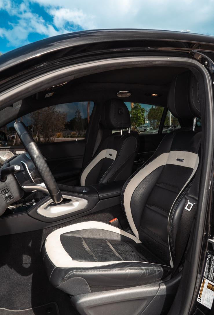 Car interior with black and gray seats on a clear day