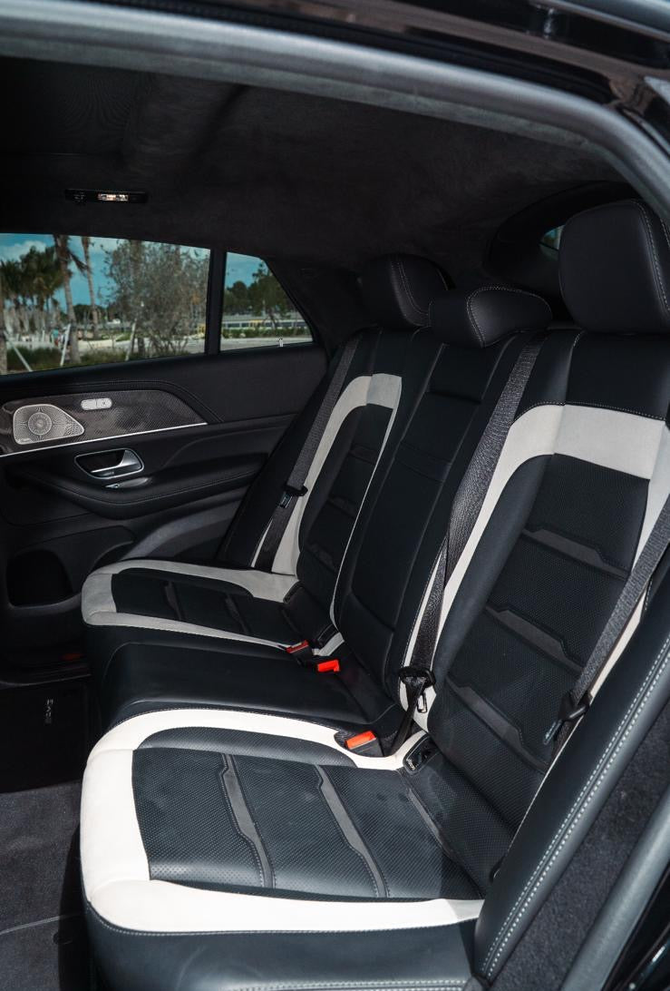 Black leather car seats with white accents inside