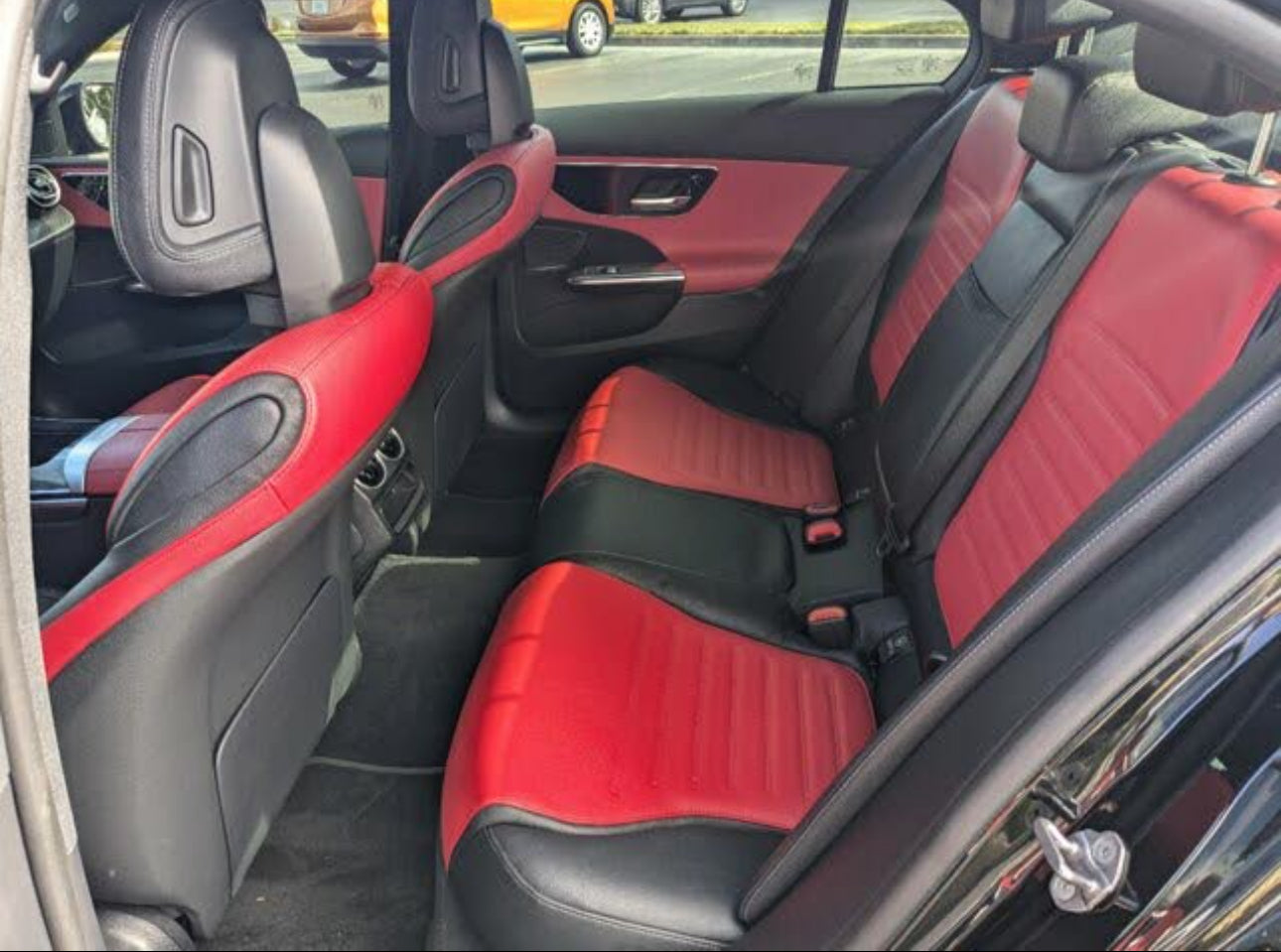 Car interior with red and black seat covers