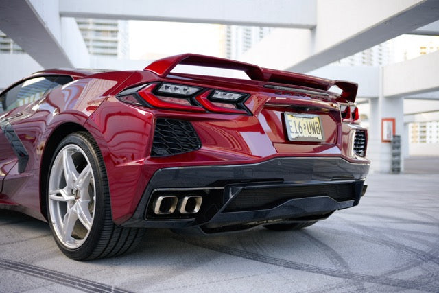 Red sports car in a modern indoor setting