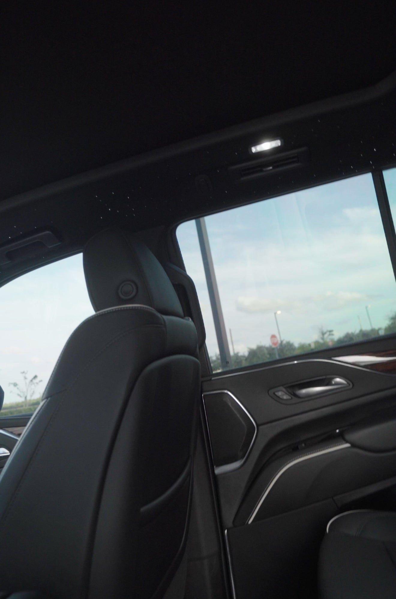 Car interior with a focus on the door panel and window