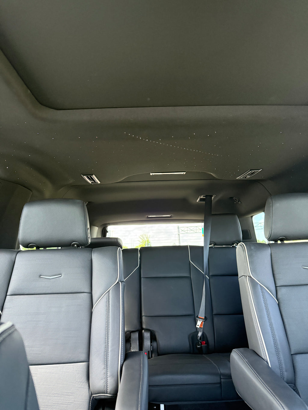 Black vehicle interior with folded seats