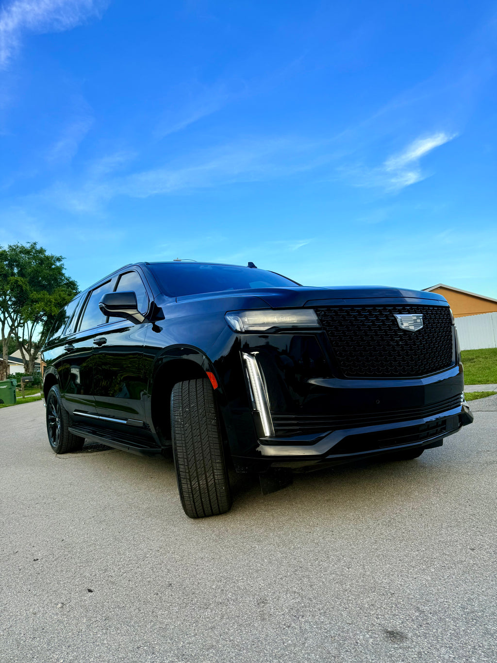 Black Cadillac SUV parked in Miami Beach.