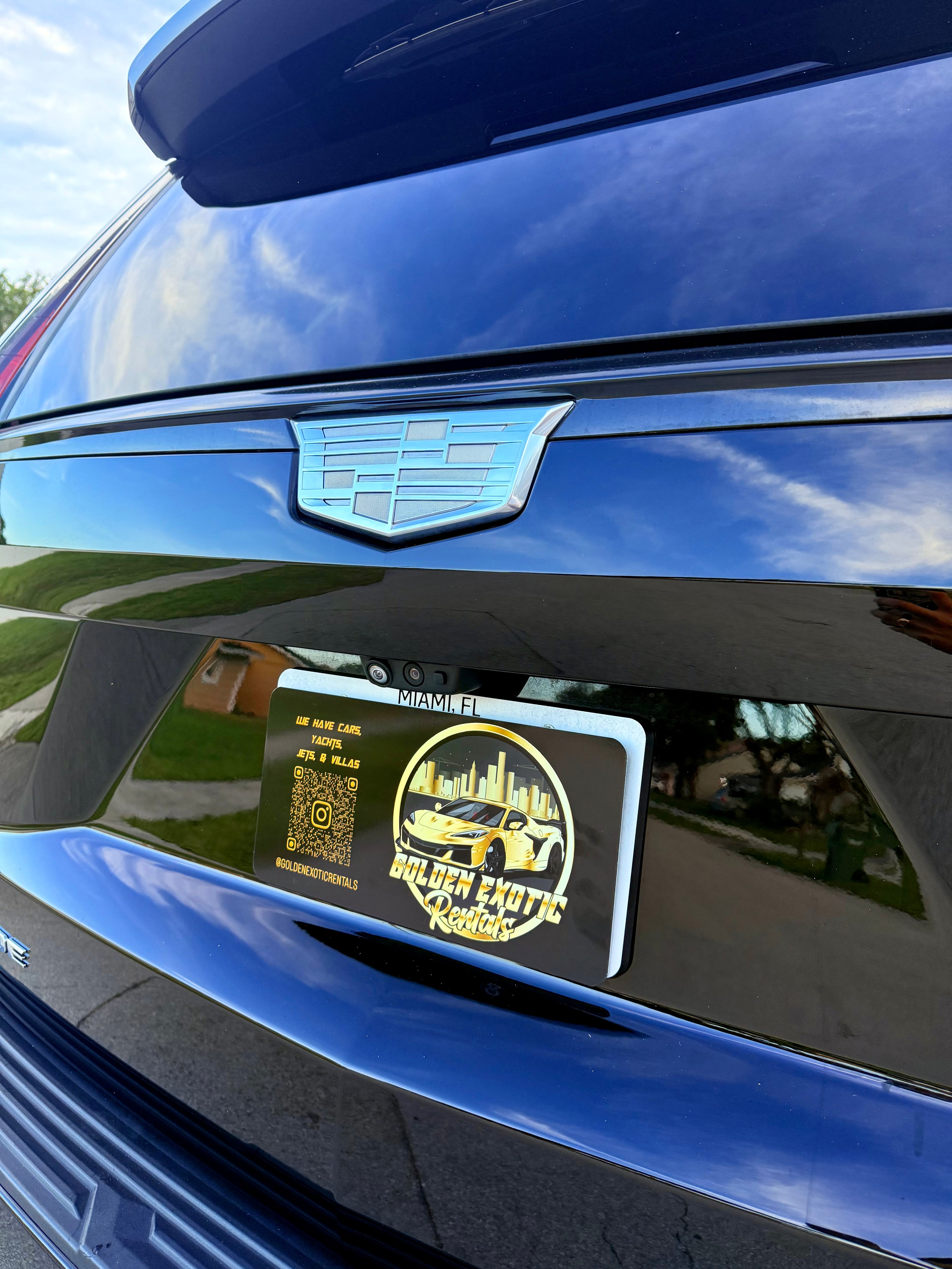 Black Escalade with a visible logo on a clear day