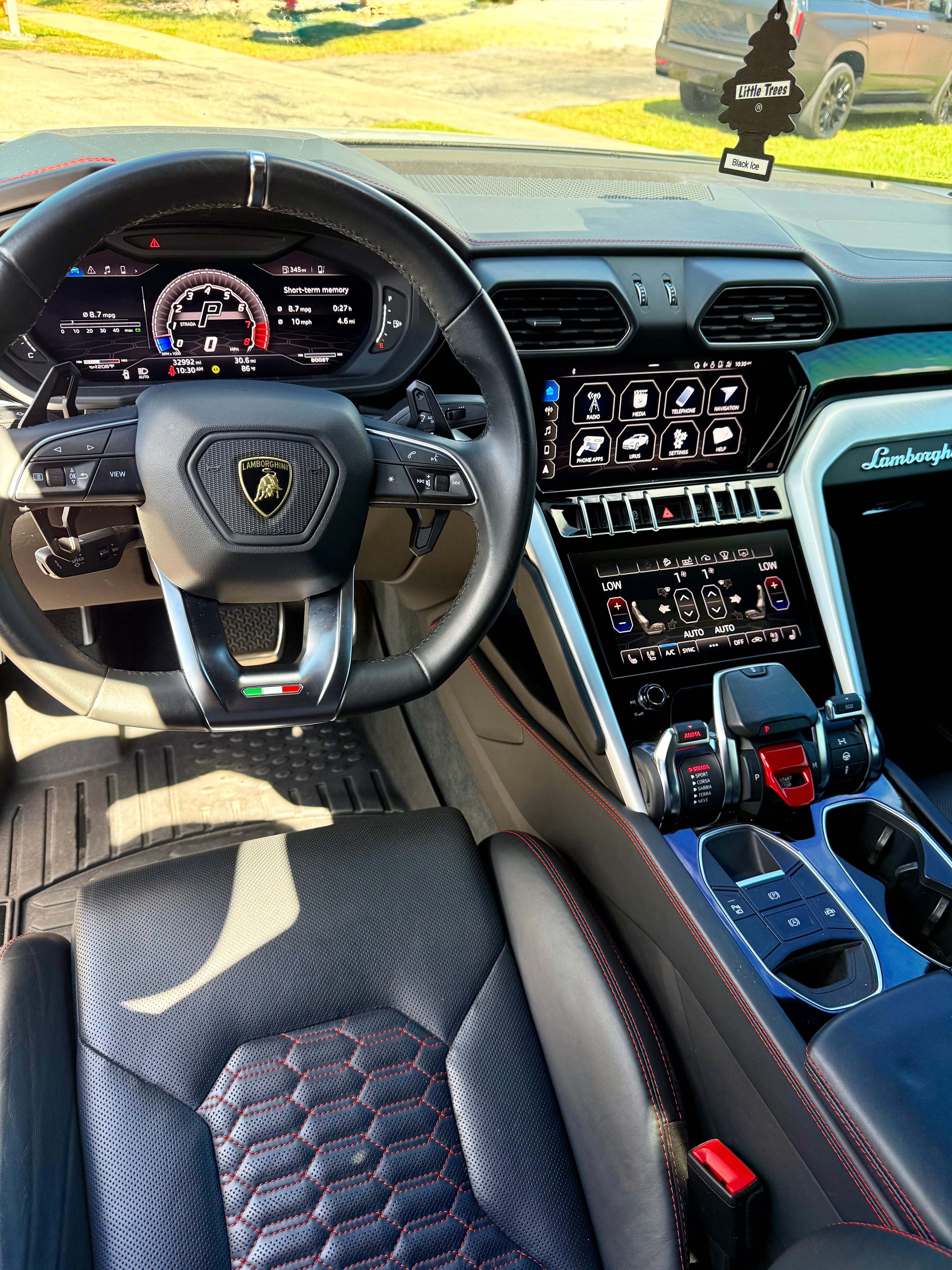 Luxury Lamborghini interior with steering wheel and dashboard