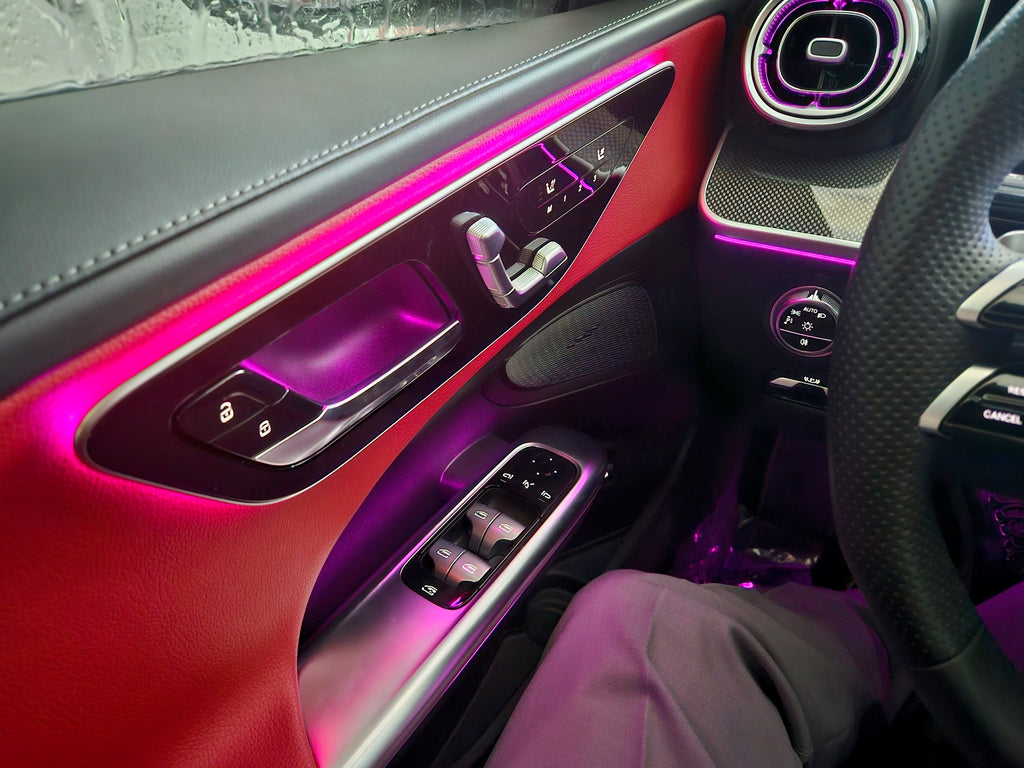 Car interior with pink ambient lighting