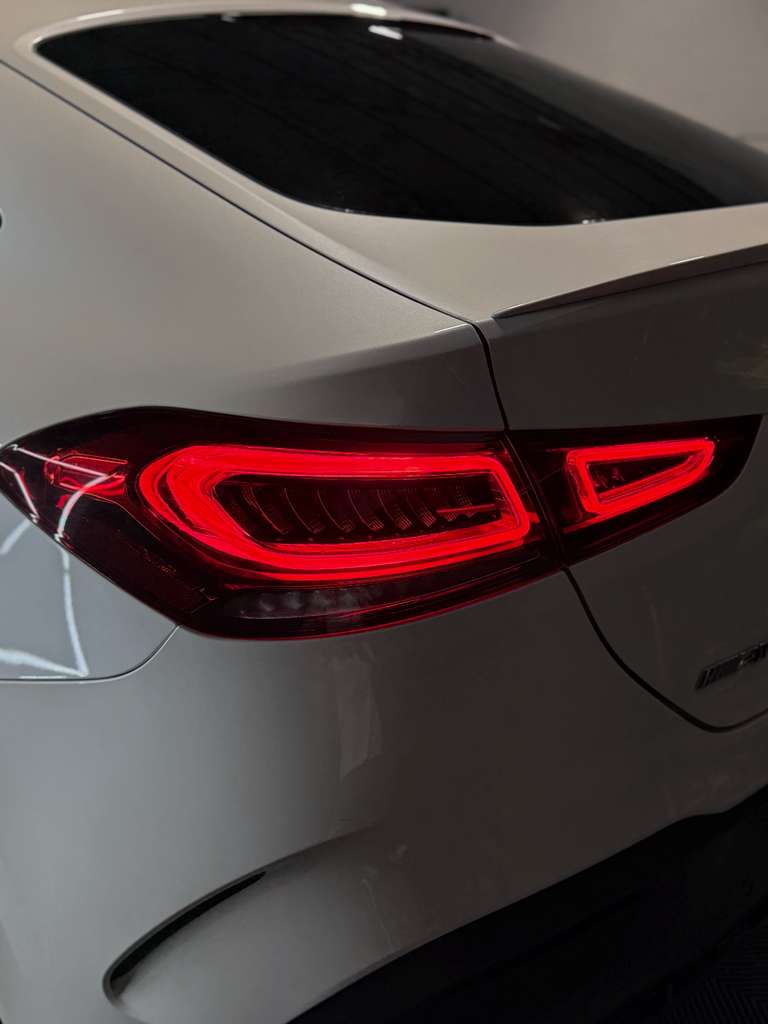 Close-up of a car's taillight on a gray vehicle