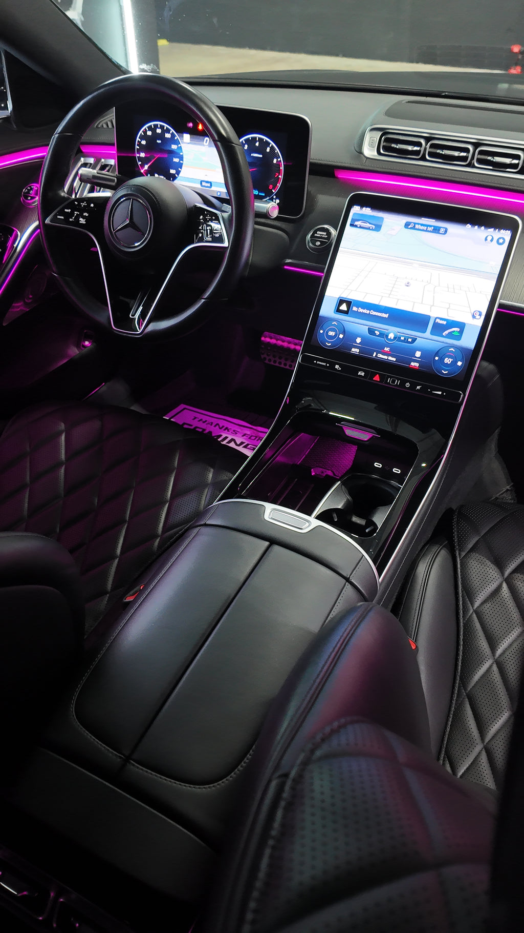 Luxurious car interior with a focus on the dashboard, steering wheel, and center console of our S580 Two tone.