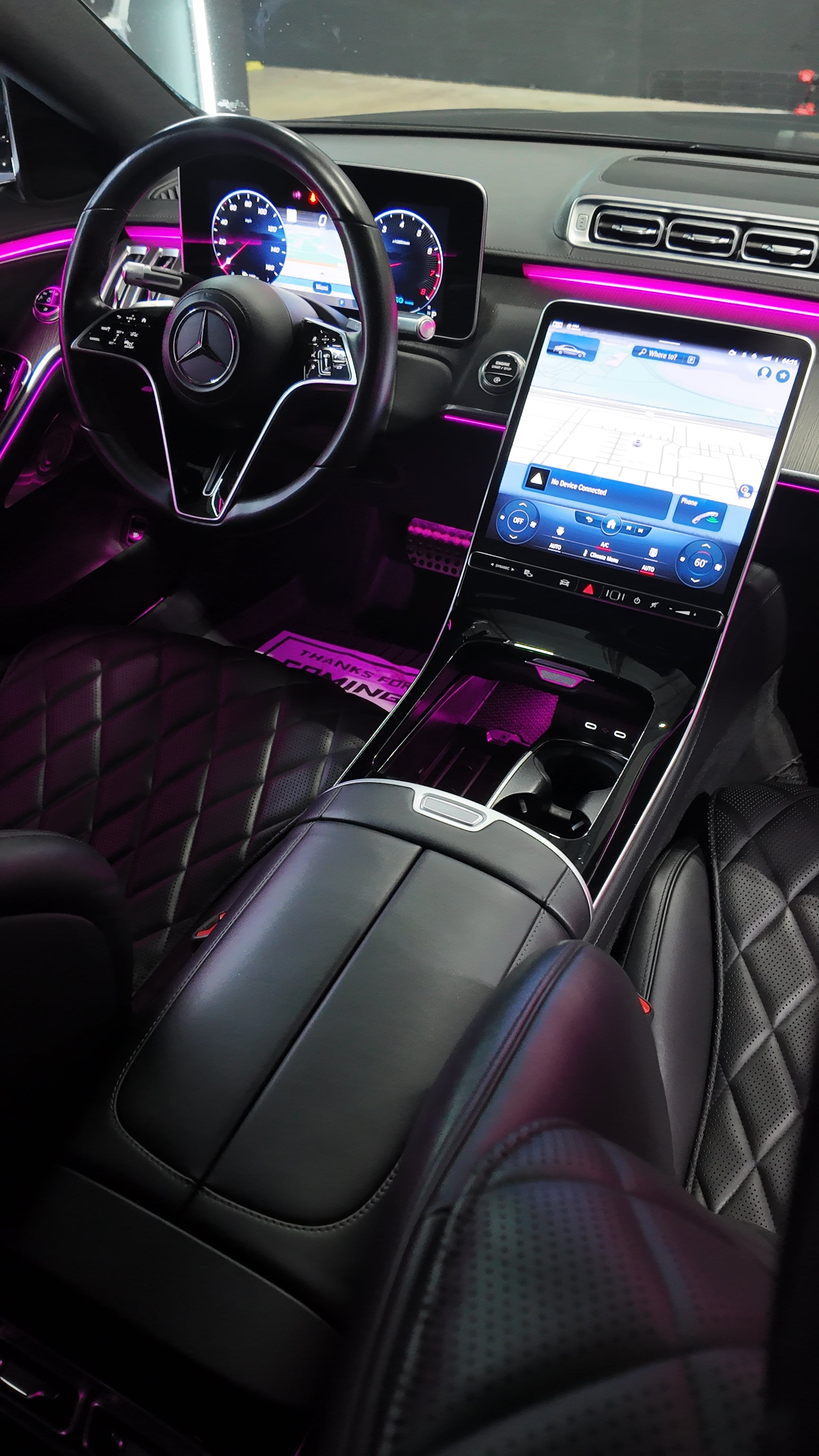 Luxurious car interior with a focus on the dashboard, steering wheel, and center console of our S580 Two tone.