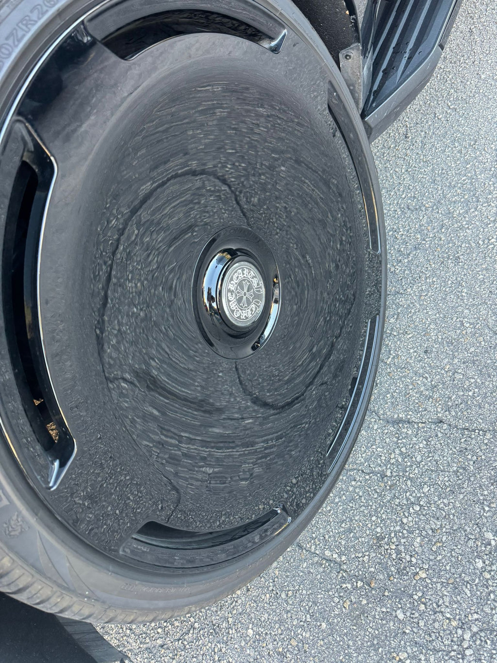 Close-up of a car wheel with a detailed view of the rim and tire tread.
