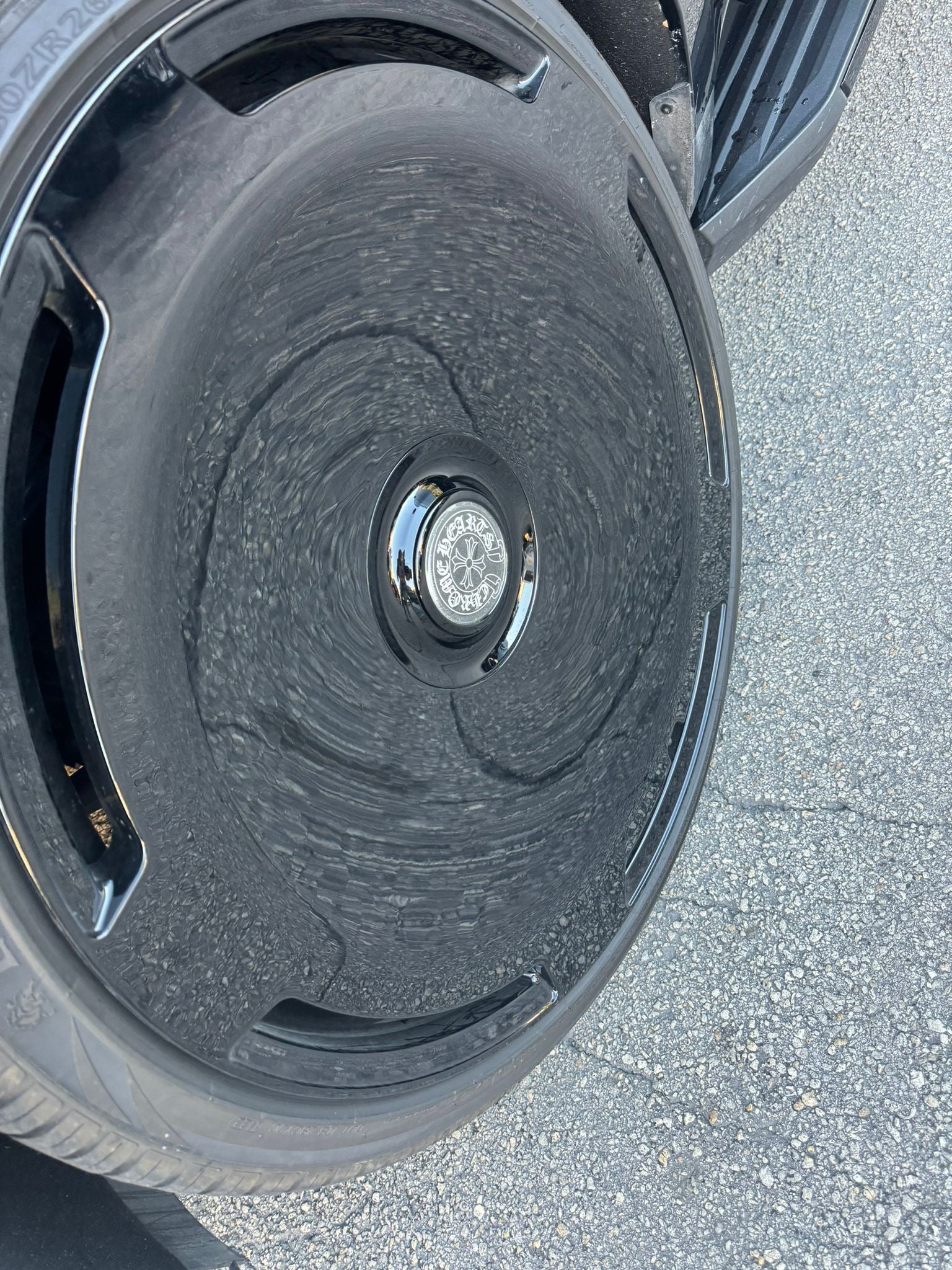 Close-up of a car wheel with a detailed view of the rim and tire tread.