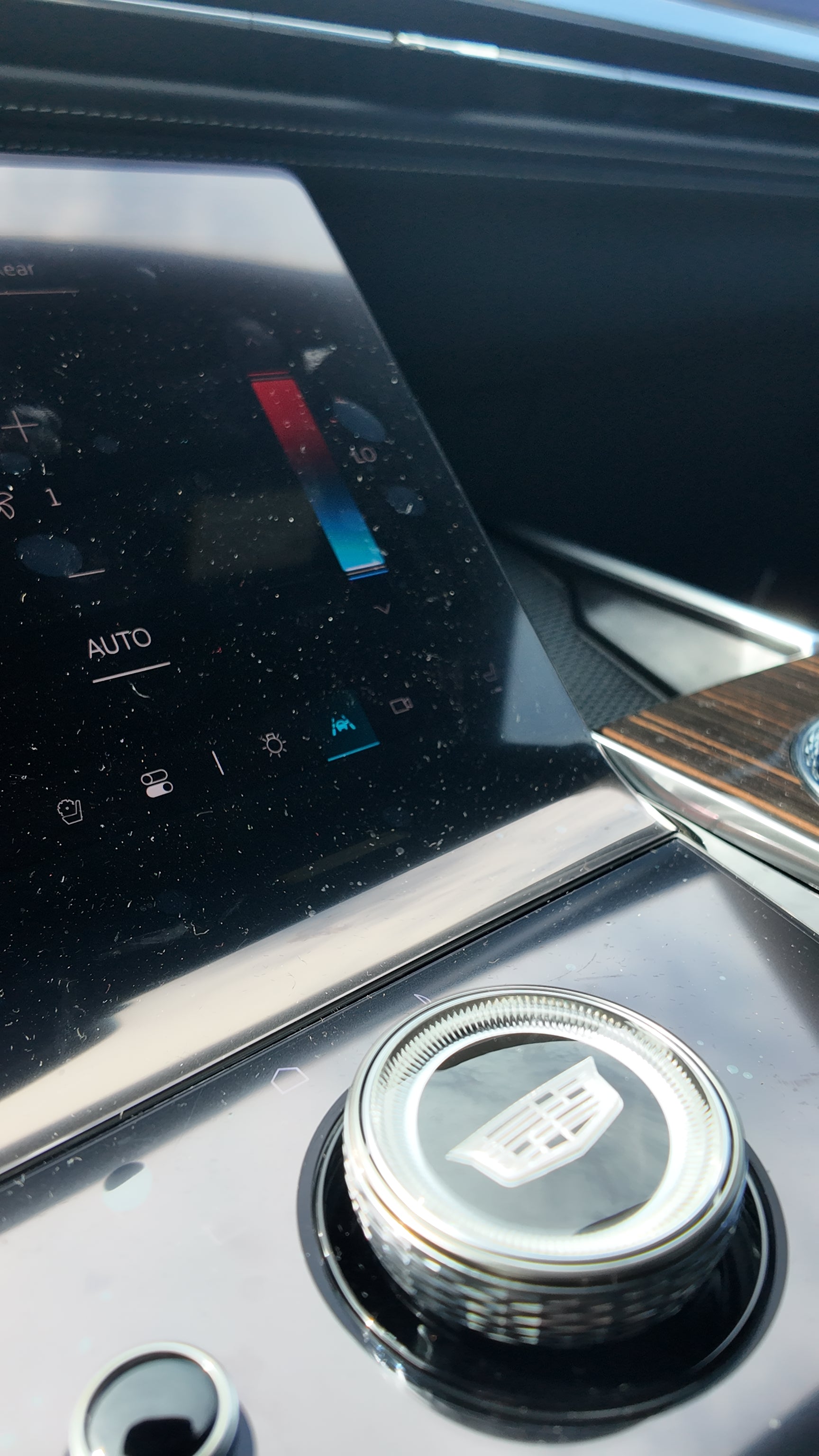 Car climate control panel with a silver knob